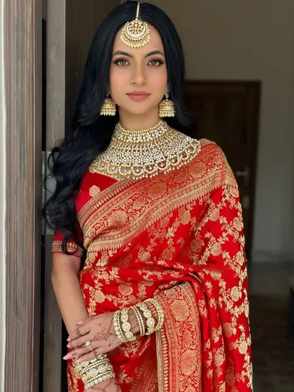 The bride looks like royalty with her stunning jewelry and simple, elegant hairstyle.