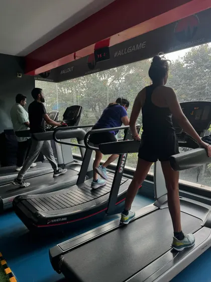 Clients warm up or cool down on the treadmills, with a view of the greenery outside. Our cardio equipment is positioned to make your session more enjoyable.
