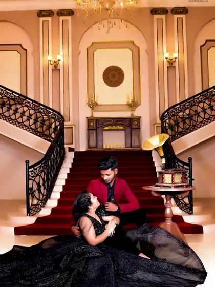 Creating coordinated outfits for couples is one of my favourite things to do. This pre-wedding shoot features a dramatic black tiered gown for her and a sharp red blazer for him, designed to complement each other perfectly for a memorable photo.