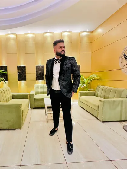 Dressed in a tuxedo, ready for the upcoming wedding season. I take pride in looking the part for your special day.