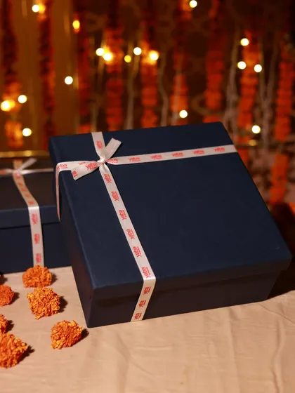A simple yet elegant corporate gift box for Yatra, tied with a custom-branded ribbon for a clean and professional look.