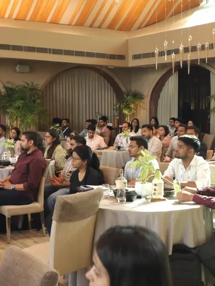 Attendees of the Team Computers workshop, seated in a classroom-style setup in our elegant indoor hall.