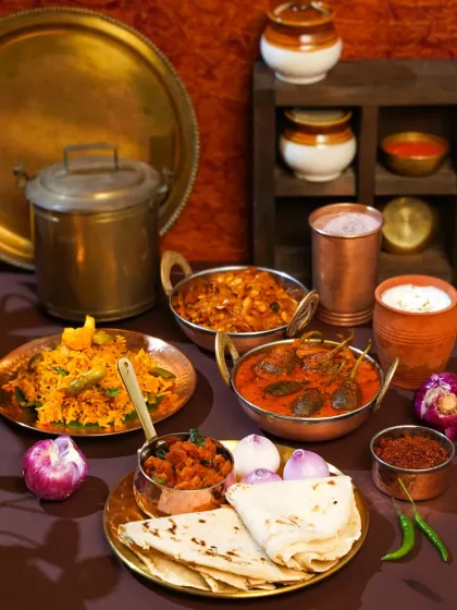 This frame is a story of home. Inspired by a trip to Ratnagiri, we recreated the warmth of a traditional Maharashtrian kitchen using authentic brass and copperware. Our goal was to capture the soul of the cuisine, making you feel the nostalgia of a meal cooked on a 'chulha'.