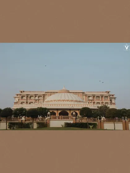 A wide shot of the magnificent Indana Palace in Jodhpur. This photo sets the scene for a grand destination wedding, showcasing the beauty of the chosen venue.