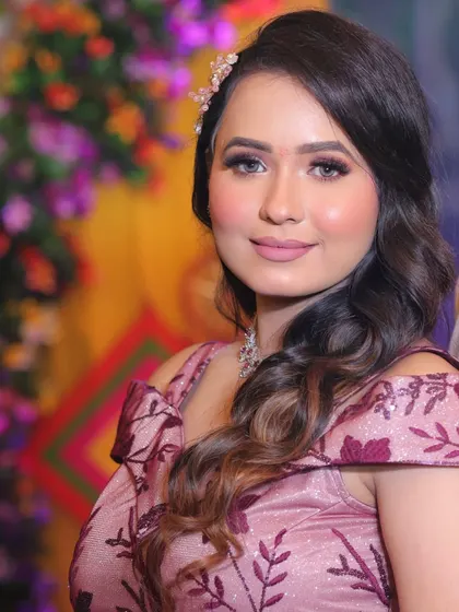 A close-up of Pihu's engagement makeup. The soft matte lipstick and defined eyes create a look that is both modern and timeless.