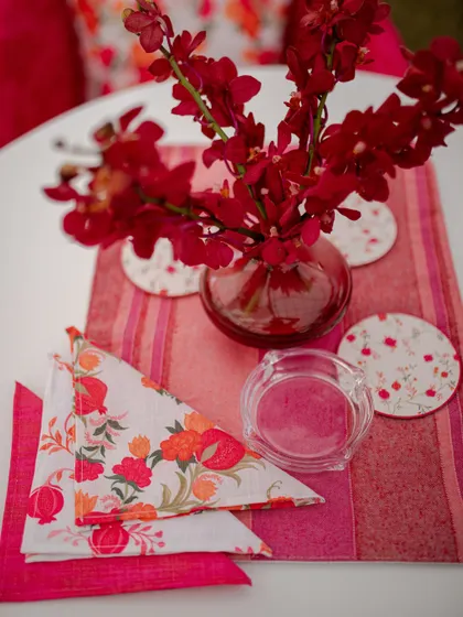 The tablescape for the Mehendi lunch, with custom-printed napkins and coasters that match the 'Gulnar' theme.