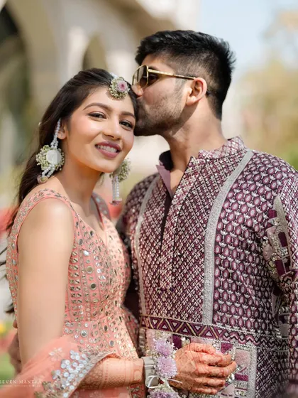 A sweet forehead kiss during the morning festivities. This photo captures a tender moment amidst the fun and energy of the Haldi event.