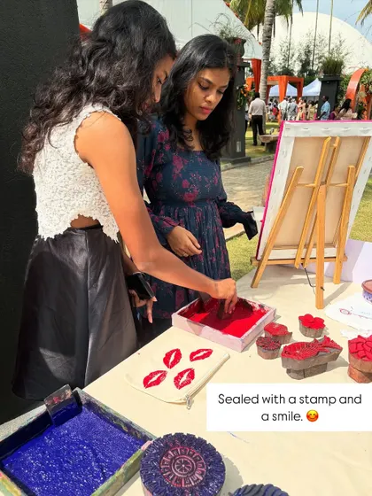Sealed with a stamp and a smile. Guests at a Nesara wedding have fun printing with our popular lip-shaped blocks. It's all about expressing yourself and enjoying the process.