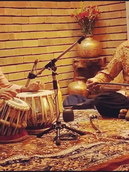 Rehearsing with Sarfaraaz Khan in a studio setting.