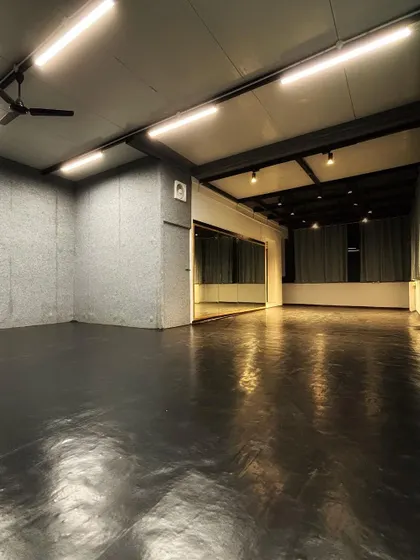 This is our main dance hall, complete with professional flooring and lighting. I designed it to be a versatile space for everything from high-energy hip-hop to calm yoga sessions.