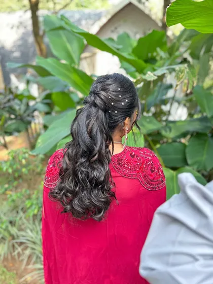 This shot captures the texture and volume of the curls in this beautiful half-updo.