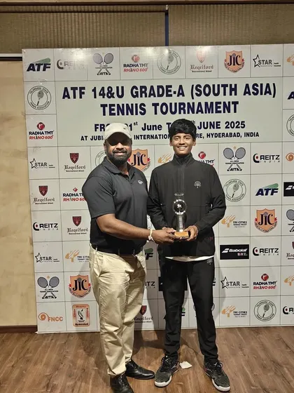 A coach's pride is in his player's success. Presenting the trophy to Rishikesh Mane for his podium finish at the ATF 14&U Grade A tournament in Hyderabad. His dedication is an inspiration.