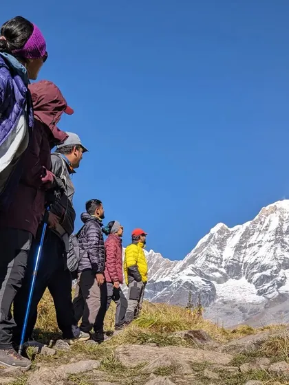 Our group gazes at the Annapurna range. I believe in uniting people to appreciate and conserve these majestic peaks for future generations.
