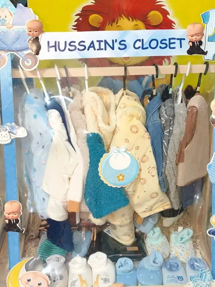 Another 'Hussain's Closet' hamper, this one with adorable winter wear and bibs.