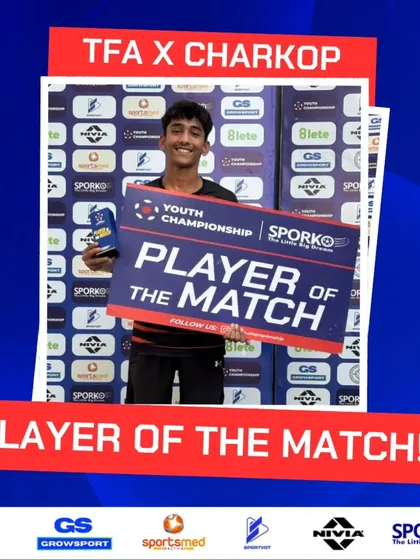 Commanding the pitch like a true star. A player receives his Player of the Match award.