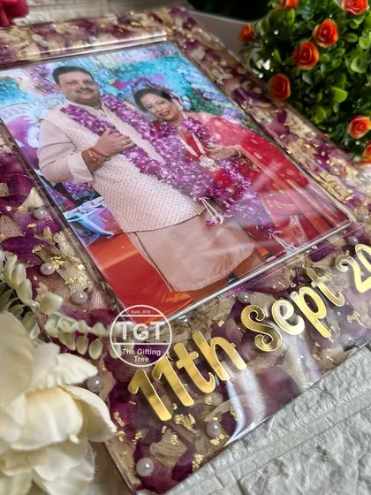 This 9x12 inch rectangular frame was created to celebrate a 25th wedding anniversary. I preserved the couple's original wedding garlands, giving them new life in this beautiful keepsake.