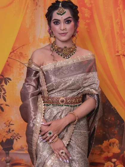 The model's pose highlights the intricate details of the waist belt and the choker.