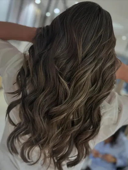 A cool blonde balayage blend that looks stunning on long hair. I used a back-to-back foil technique to achieve this level of brightness and blend.