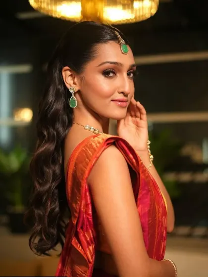A side view of the wavy ponytail, showing how it creates a look that is both elegant and effortless.