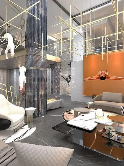 A view of the mezzanine level overlooking the main living area. The design continues the theme of sculptural art and metallic accents, ensuring a cohesive aesthetic across different levels of the home.