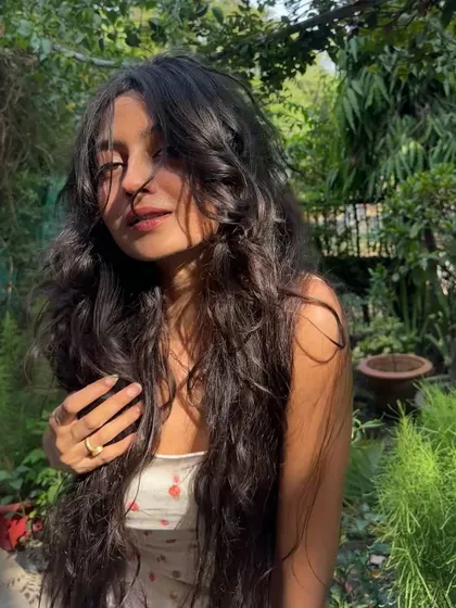 A sun-kissed, happy moment surrounded by greenery. Waking up to mornings like this is what vacation is all about.
