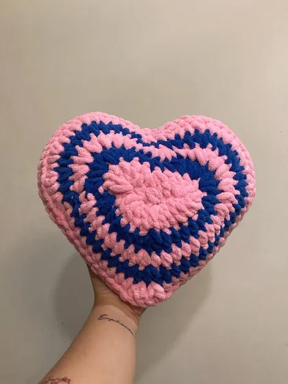 I love playing with color combinations for my heart pillows. This one features a fun pink and blue spiral design, adding a retro pop of color to your home decor.
