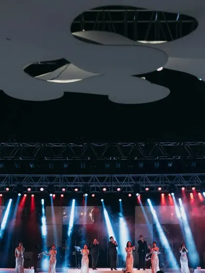 A wide shot of the Shillong Chamber Choir on stage, showing their synced presentation and the grand scale of the production.