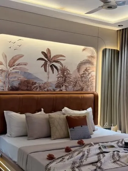 A beautiful sepia-toned tropical landscape mural provides a warm and calming backdrop for this bedroom, perfectly complementing the earthy tones of the decor.