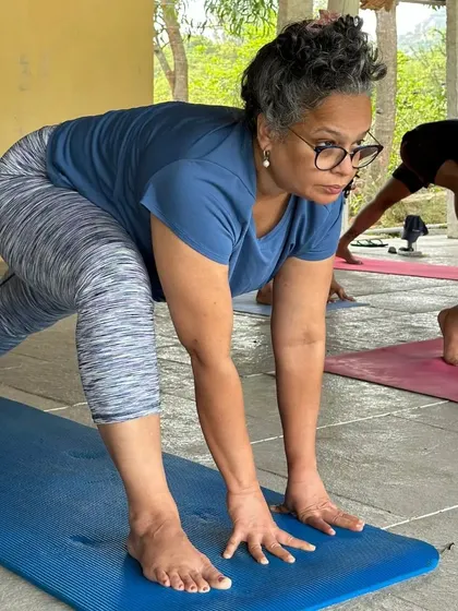 A student holds a low lunge with focus and strength during our yoga retreat. Our retreats are designed for all levels, providing a supportive environment for everyone to explore their practice.