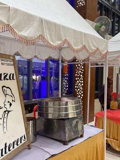 Our live counter setup, featuring our branding and a traditional steamer. This is perfect for serving momos or other steamed delicacies fresh and hot at your event.