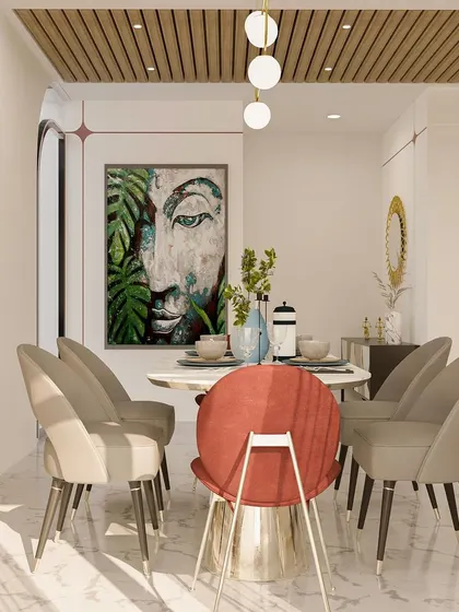 A serene dining space from the 'House of Serene' project, featuring a statement Buddha artwork and a mix of chair styles for a curated look.