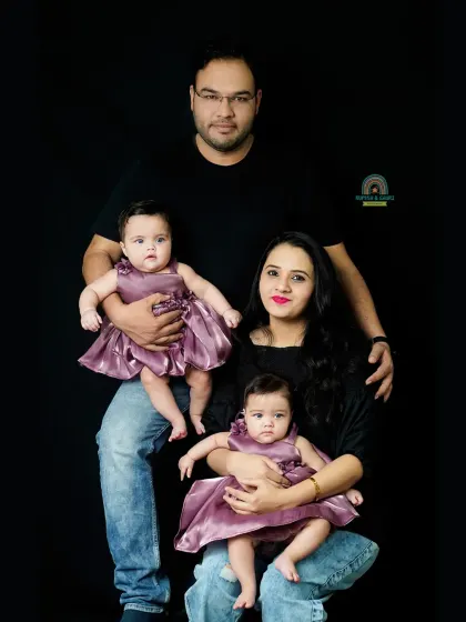 A beautiful pose with parents and their twin daughters. We guide you into natural poses that feel comfortable and result in stunning family photos.