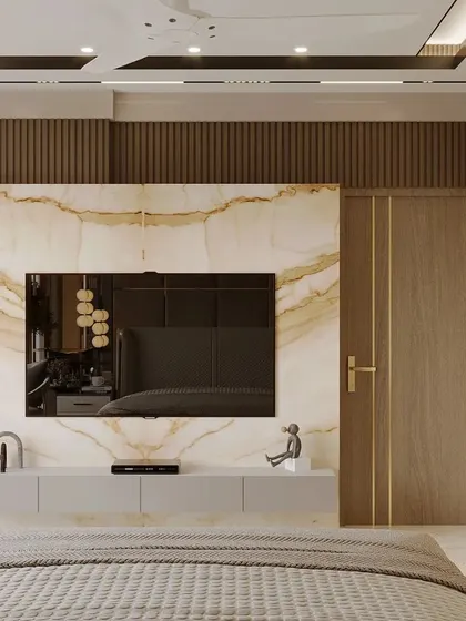 Beige is the new black. This bedroom design uses soft touches of beige and brown textures to create a soothing symphony. The TV wall features a beautiful book-matched marble slab, adding a touch of natural elegance.
