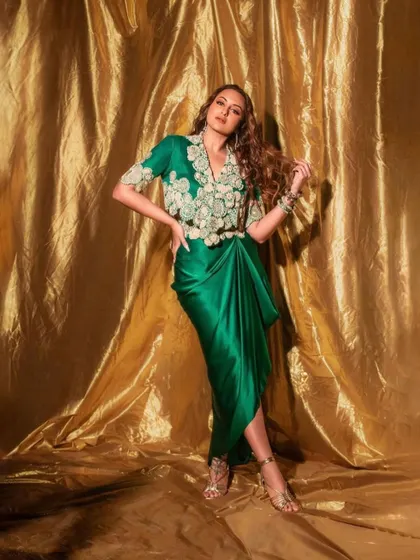For the promotions of Netflix's 'Heeramandi', I was on the team that styled Sonakshi Sinha. This emerald green Anamika Khanna ensemble, with its intricate embroidery and modern draped silhouette, was chosen to reflect the grandeur and elegance of the series.