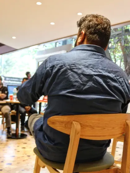 A view from behind the author, showing his perspective of the engaged and curious audience during the "Paper Bullets" book reading.