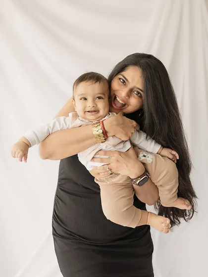 A big hug for a happy baby. This photo radiates warmth and happiness, showcasing the beautiful connection between mother and child.