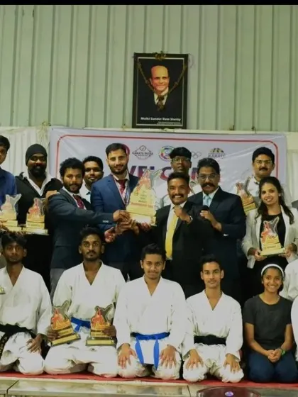 A proud moment for the entire team, celebrating our collective success at a major karate championship.