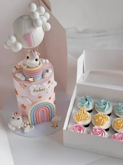 This unicorn cake is paired with matching cupcakes, a great upselling opportunity for your baking business. We cover how to create coordinated dessert tables in our business workshops.