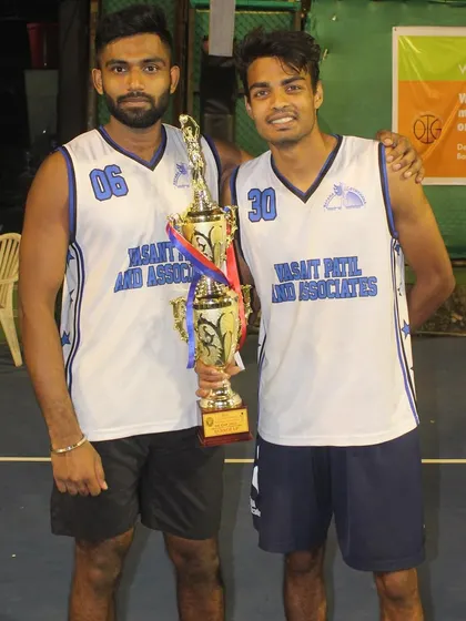 With a teammate and our trophy.