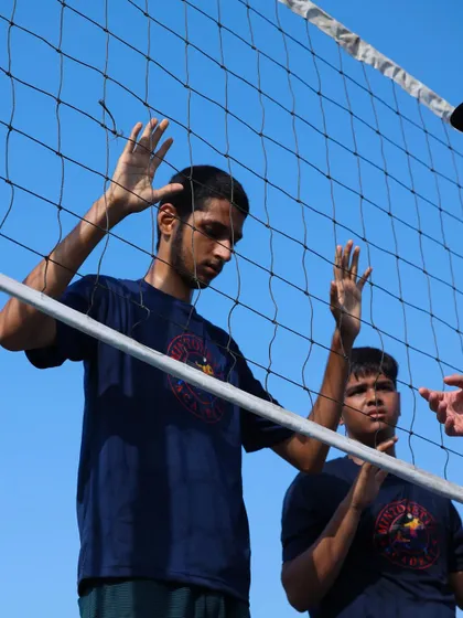 I provide real-time feedback on a player's blocking stance. Direct, individual correction helps our athletes build the right muscle memory from the start.