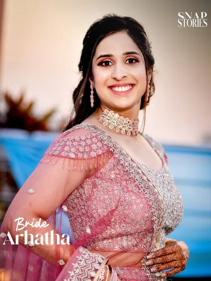 A close-up portrait of the bride, showcasing her beautiful smile and elegant jewelry. Our bridal photography focuses on making you look and feel your best.