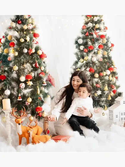 A quiet moment between a mother and her child amidst the Christmas magic. These sessions are a wonderful way to start a new family tradition.