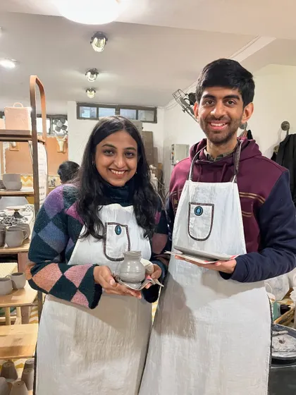 Curious about pottery? This couple is trying our taster session and proudly showing off their first creations. It's a perfect introduction to the craft, and you get to take home a handmade piece.