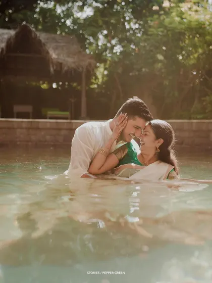 A playful and intimate moment in the water for Jayaram and Abirami. This kind of adventurous and fun shoot results in truly memorable and unique photos.