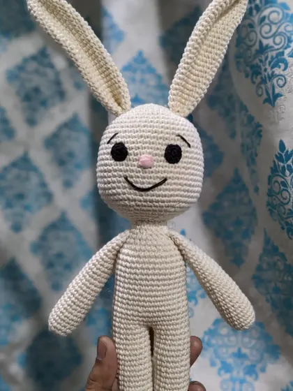 The classic white bunny held up to show its full size.