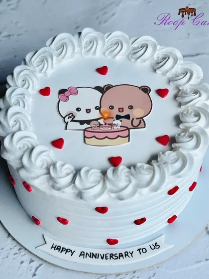A cute half-kg anniversary cake featuring adorable cartoon bears celebrating together.