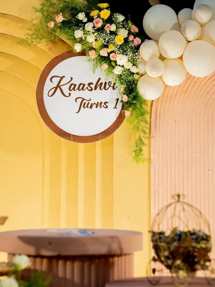 A close-up of the custom signage, showing the elegant script and floral details that add a personal touch to the celebration.