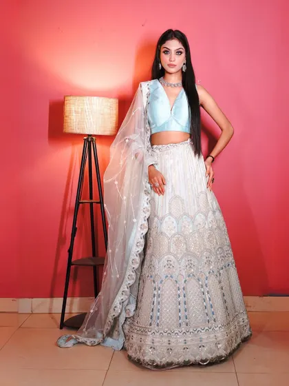 Another full-length view of the white and blue lehenga, a perfect choice for a day wedding or engagement.