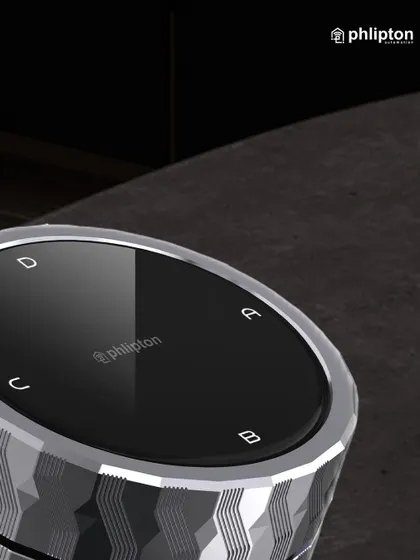 A close-up of the smart knob shows the clear icons for different scenes. The textured metal finish and polished top make it a statement piece of technology for any modern home.