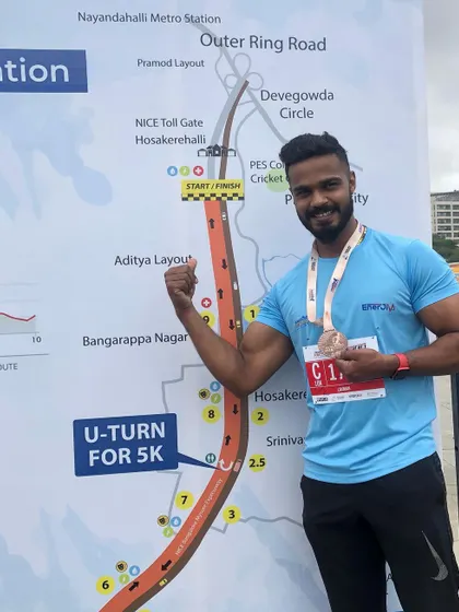 Posing by the marathon route map.